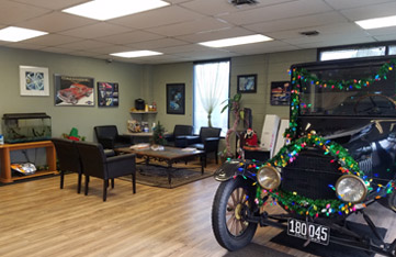 waiting area with classic car decorated inside